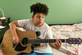 Young boy playing guitar